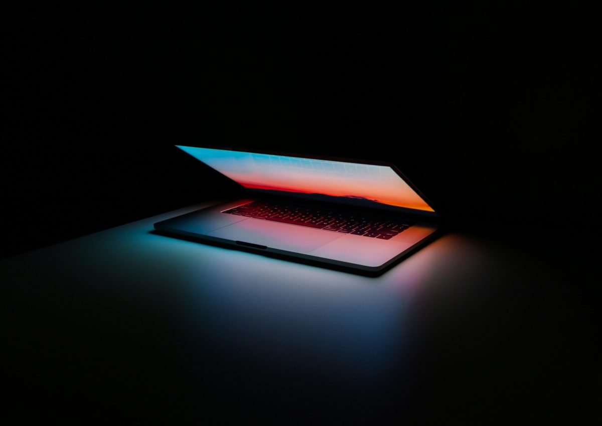Illuminated laptop partly closed