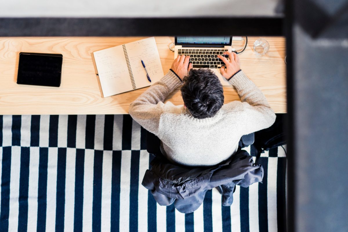 Aerial view of man working at desk